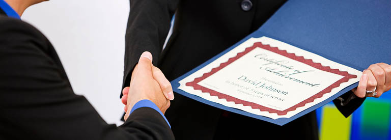 Photo of person receiving a certificate